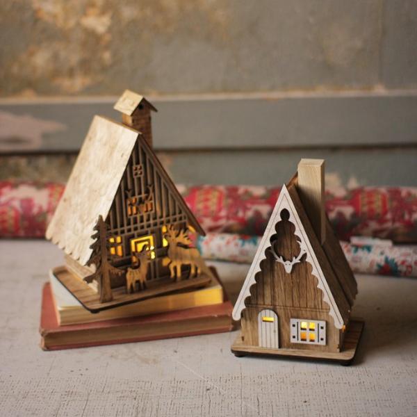 Two Wooden Lighted Houses